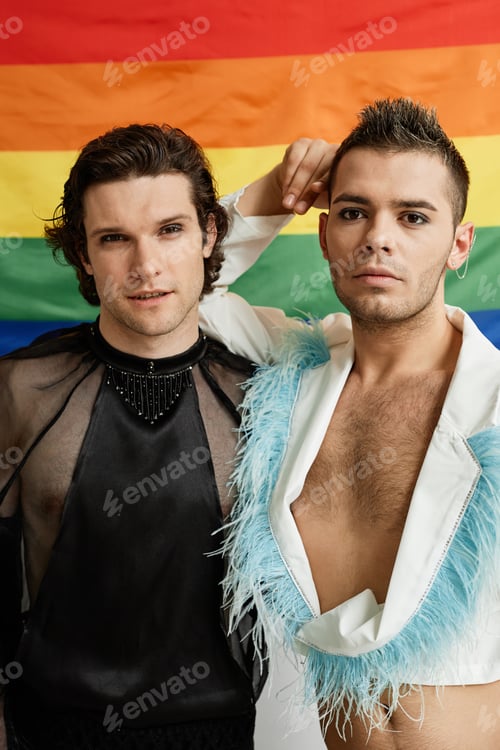Preview: Gay young men posing with LGBTQ pride flag