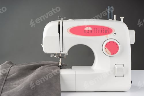 Preview: Modern Sewing Machine With Gray Fabric