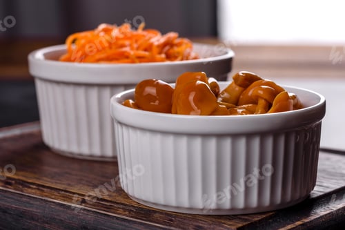 Preview: Homemade pickled honey agarics mushrooms in a white bowl