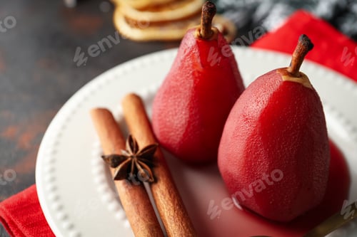 Preview: Tasty and delicious food concept - pear in wine