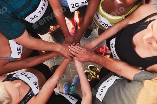 Preview: Team with hands together after competition