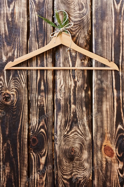 Preview: Wooden Hanger with Plant on Rustic Wood Background