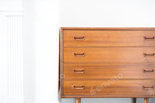 Vintage Wooden Dresser against White Wall