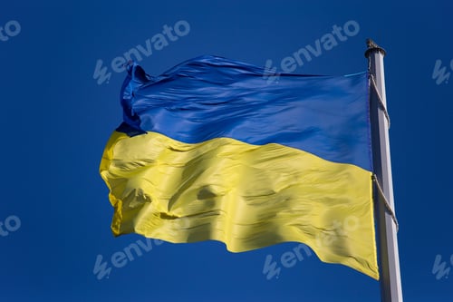 Preview: National flag of Ukraine against blue sky