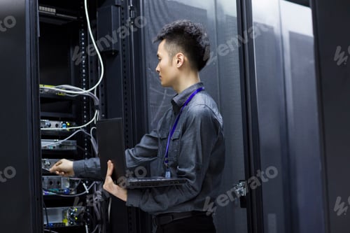 Preview: Technician doing maintenance in computer room