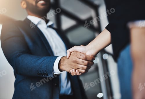 Preview: Closeup shot of two unrecognizable businesspeople shaking hands in an office