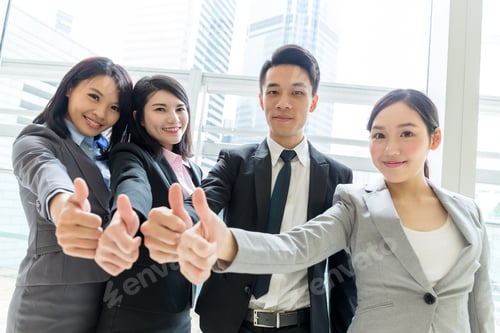 Preview: Group of business people showing thumb up together
