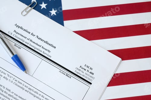 Preview: N-400 Application for Naturalization blank form lies on United States flag