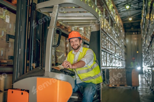 Preview: Feeling Good. Young Bearded Worker Smiling And Looking Positive