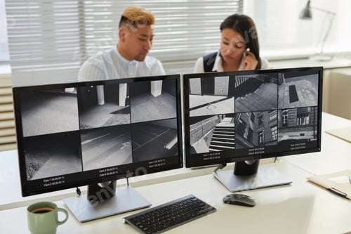 Preview: Background image two computer screens with multiple surveillance camera feeds