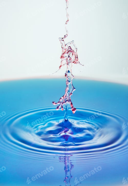 Preview: Abstract background of splash of color water, collision of colored drops