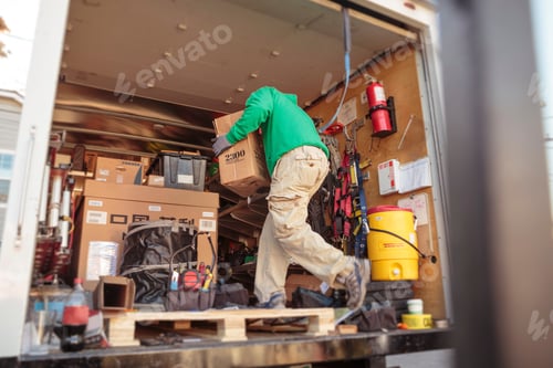 Preview: Solar panel installation crew member in truck