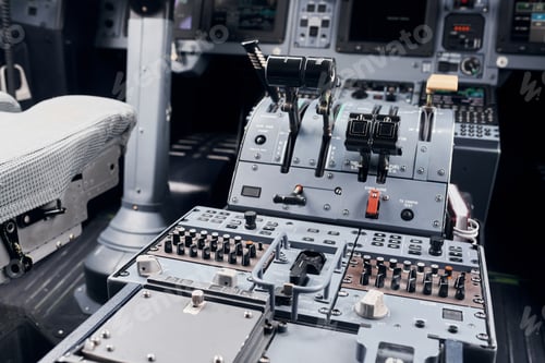 Preview: Knobs and buttons. Close up focused view of airplane cockpit