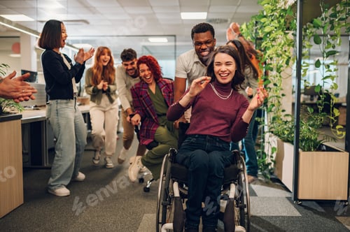 Preview: Woman who uses a wheelchair winning the office chair race and celebrating