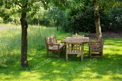 Preview: Empty wooden table with bench and chairs in garden