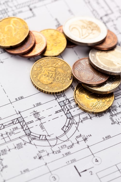 Preview: architect house plane and coins, investment in new home concept