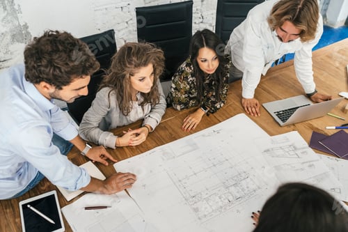 Preview: Young team of coworkers making great work discussion in modern c
