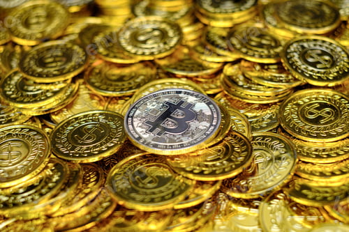 Preview: Golden bitcoin cryptocurrency on pile gold coins a lot of