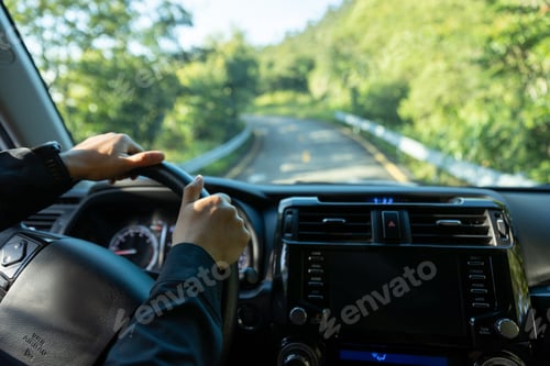 Preview: People driving car on morning mountain road