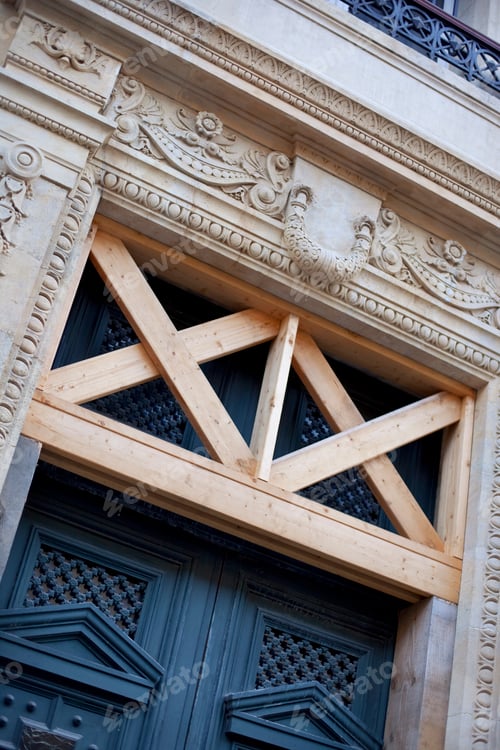 Preview: Wooden door and support beams of a French mansion