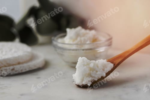 Preview: Closeup of a spoonful of Shea butter.
