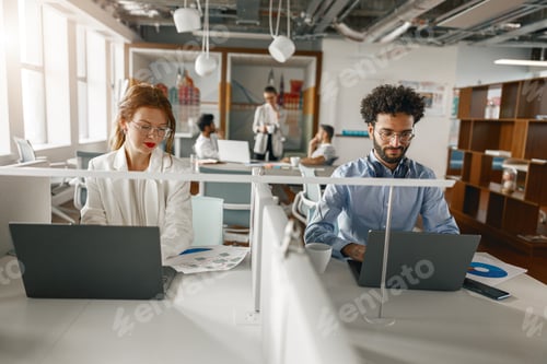 Preview: Businesspeople working together in bright office, sitting at desk