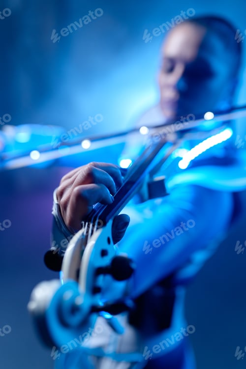 Preview: Woman violinist playing electric futuristic violin with selective focus