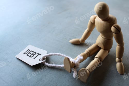 Preview: Wooden human figure and tag DEBT.