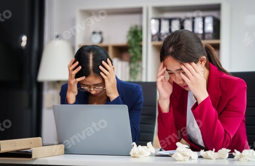 Preview: Two Asian businesswomen under stress and pressure discuss financial matters, experiencing anxiety