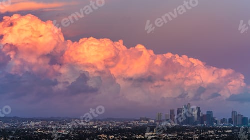 Preview: Sunset view of bright colored storm clouds approaching downtown Los Angeles, California