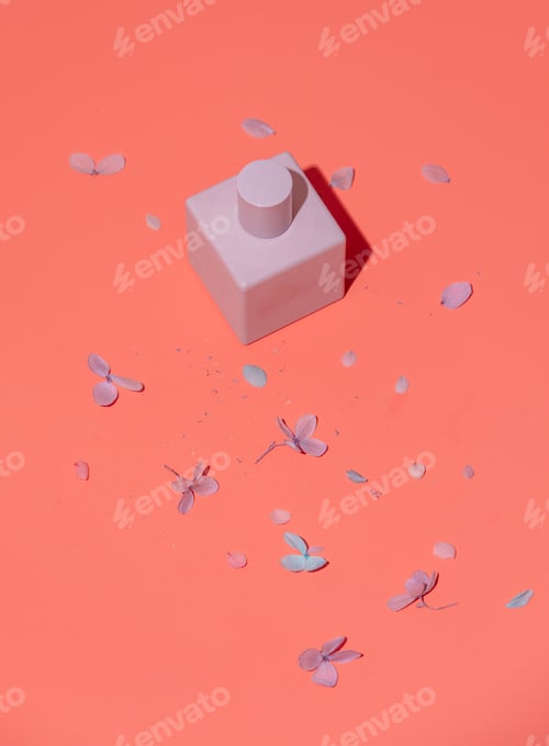 Preview: Cosmetic bottle and flower petals around.