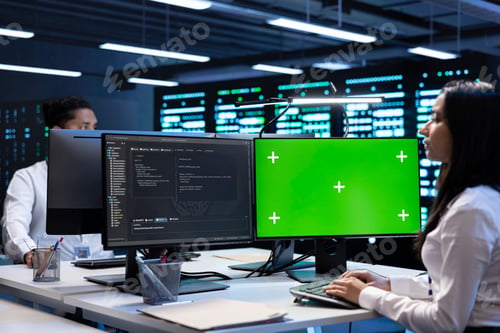 Preview: Specialists using green screen PC to check server clusters