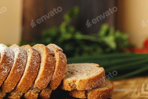 Preview: Sliced loaf of bread on wooden board