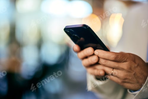 Preview: Close-up of a female hands holding and using a mobile phone.