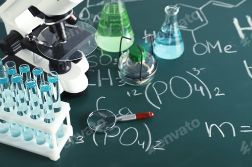 Preview: Laboratory glassware and microscope on blackboard with chemical formulas