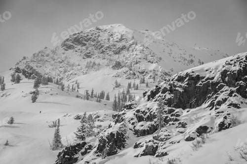 Preview: Grayscale of a rugged mountain covered in snow in Utah