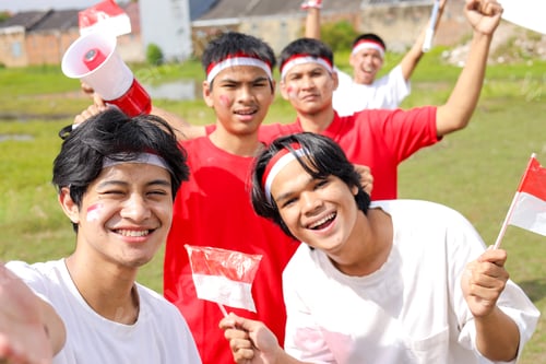 Preview: A Group Of Young People Happily Celebrate Indonesian Independence Day With Flags And Megaphones.