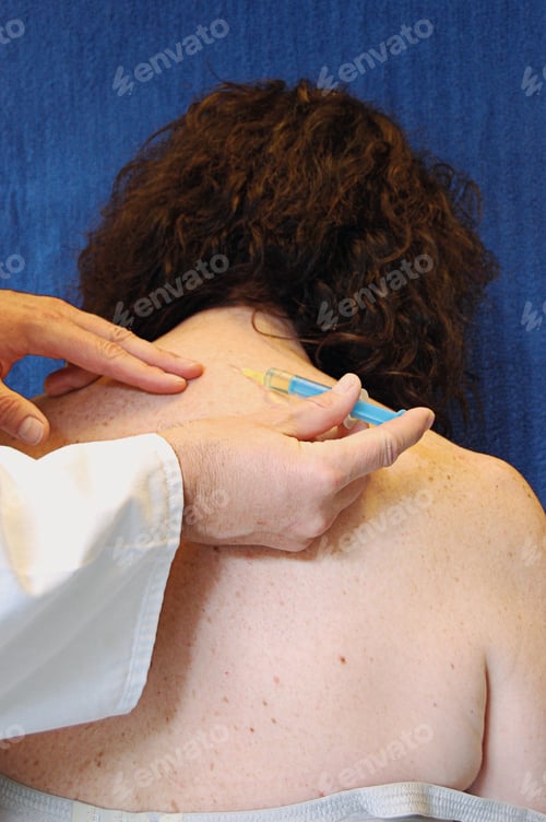 Preview: injection with syringe in neck of a woman, back therapy