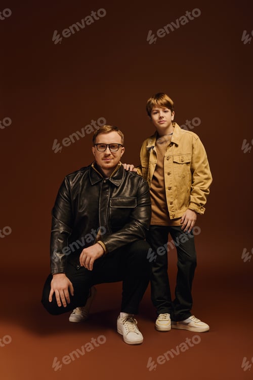 Preview: Joyful moments between father and son in a stylish studio setting