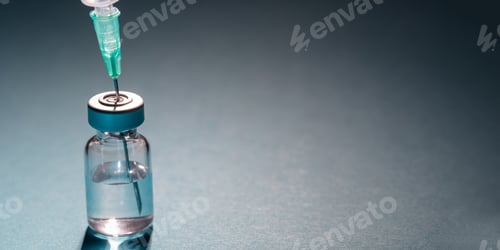 Preview: Vaccine vial dose and syringe against gray blue background