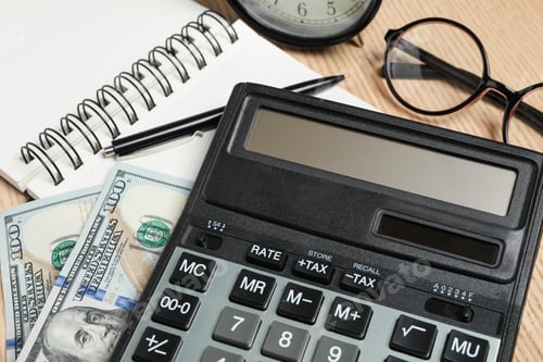 Preview: Calculator, money and stationery on table, closeup. Tax accounting