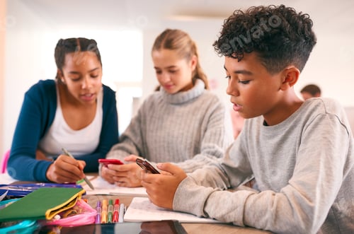 Preview: Secondary Or High School Students In Study Area Working Together Using Mobile Phones