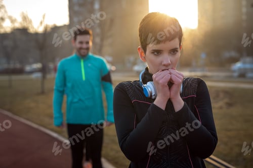 Preview: Woman fitness exercising in cold weather outdoor