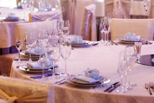Preview: luxury decorated tables at rich wedding reception