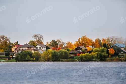 Preview: Cottages on the lake. Rural views of the beautiful homes in autumn.