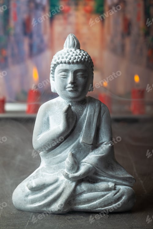 Preview: stone statue of buddha on a stone window sill surrounded by flowers and smoke - asian celebrations
