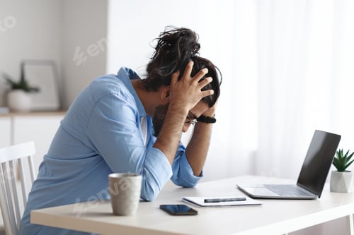 Preview: Work Problems. Millennial Freelancer Guy Siting At Desk And Touching Head In Despair