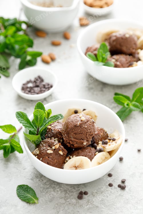 Preview: Chocolate and banana fruit ice cream with almond nuts served in bowls