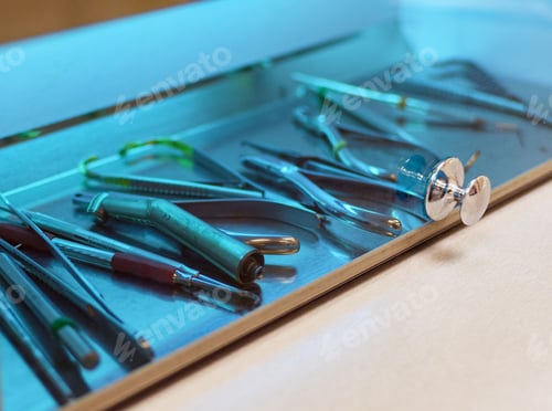 Preview: Close-up image of dental instruments in an UV sterilizer.