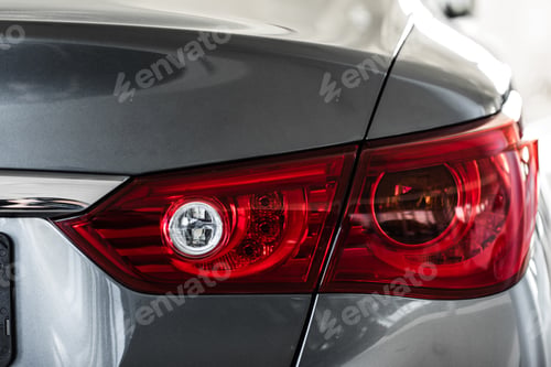 Preview: Back lights of black car. Car headlight. the back of the car